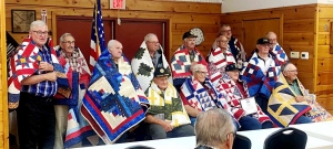 During the annual member appreciation dinner, American Legion Post 350 received Quilts of Valor from Barbara Sigmund of the Quilts of Valor Foundation. From left, standing, are Richard Knuth, Charles Leuth, Art Biesek, Lee Stoddard, Harlan Farber, Joe Gray,  Bob Ott, William Schorer and Frank Dischler; seated from left: Robert Horkan, Charles Backeberg, Dale Terrill and Walter Farber. (Submitted photo)