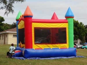 Kids play in the bounce house during Sacred Heart’s Fall Festival Sunday. 