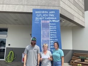 Brewster’s Lanes donated $1,000 to the splash park project. From left are Brady Bill of Brewster’s Lanes, Pam Coy on behalf of the project, and Paige Dunse of Brewster’s Lanes. (Submitted photo)